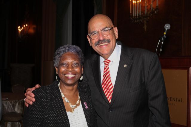 Mary Melchor congratulates Judge William Hooks.