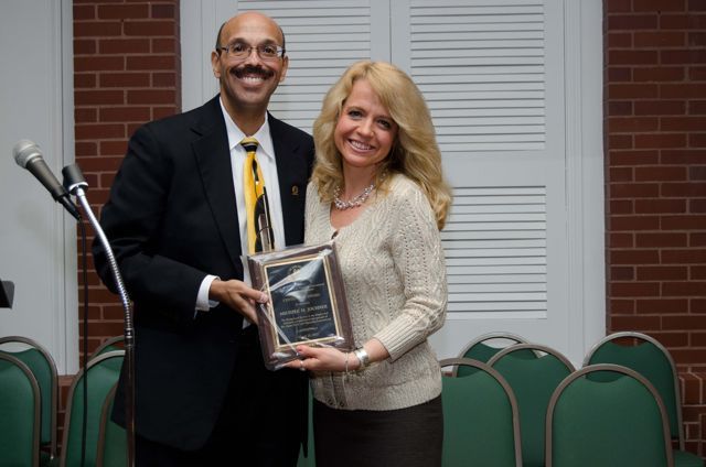 Presentation of the Chapter's Centennial Award by Chapter Justice Pierre Priestley to Past Chapter Justice Michele Jochner.