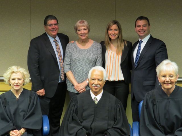 ISBA 2nd Vice President Richard D. Felice (rear, left) is shown with new admittee Stephanie Sainsbury (rear, second from left), her mother and Justinian Society President Gregg Garofalo. Seated at front are Illinois Suprme Court Justices Anne Burke, Charles Freeman and Mary Jane Theis.