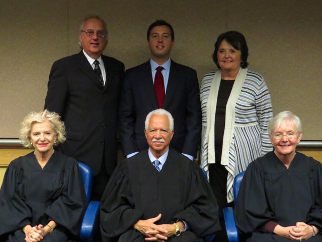 New admittee Benjamin Goluska and family with Justices Burke, Freeman and Theis.