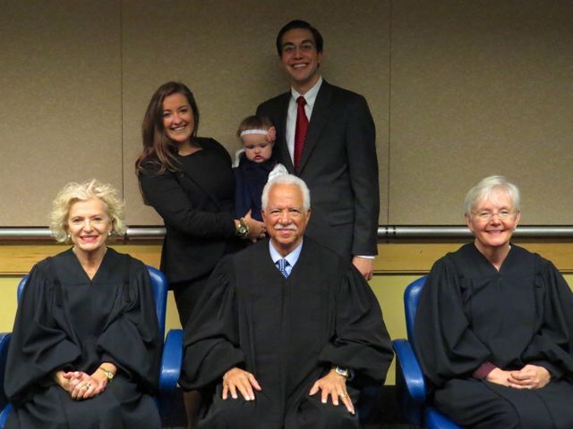 New admittees Kristin Creed and Matthew Howeth with their daughter Jordyn Rose with Justices Burke, Freeman and Theis.