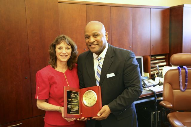 Event organizer and ISBA Director of Bar Services Janet Sosin presents a plaque to Perry Thompson, Supreme Court Director of Admissions
