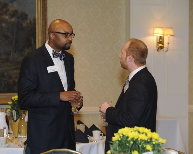 ISBA 2nd Vice President Vincent Cornelius (left) speaks with an attendee