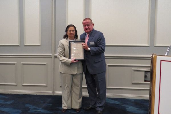 Lynn Patton, Austin Fleming Newsletter Editor Award recipient,&nbsp;and President Russell Hartigan
