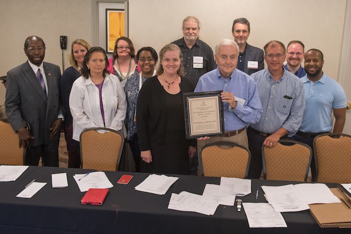Patrick Driscoll receives an award
