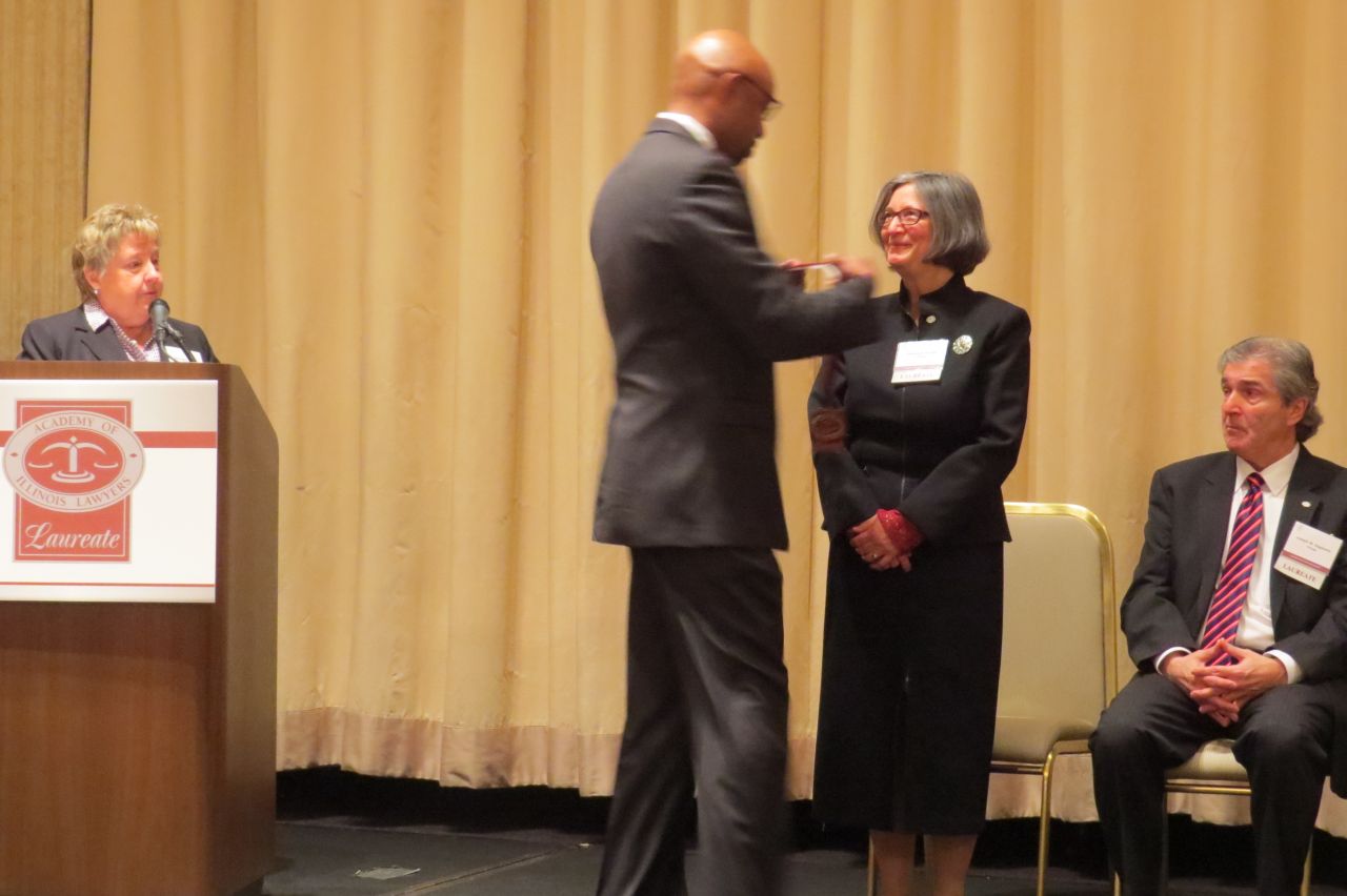 Vincent Cornelius awards Patricia Bronte with her award
