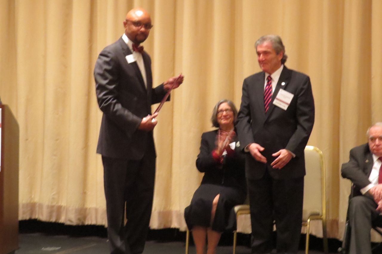 Vincent Cornelius present Joseph Gagliardo his award
