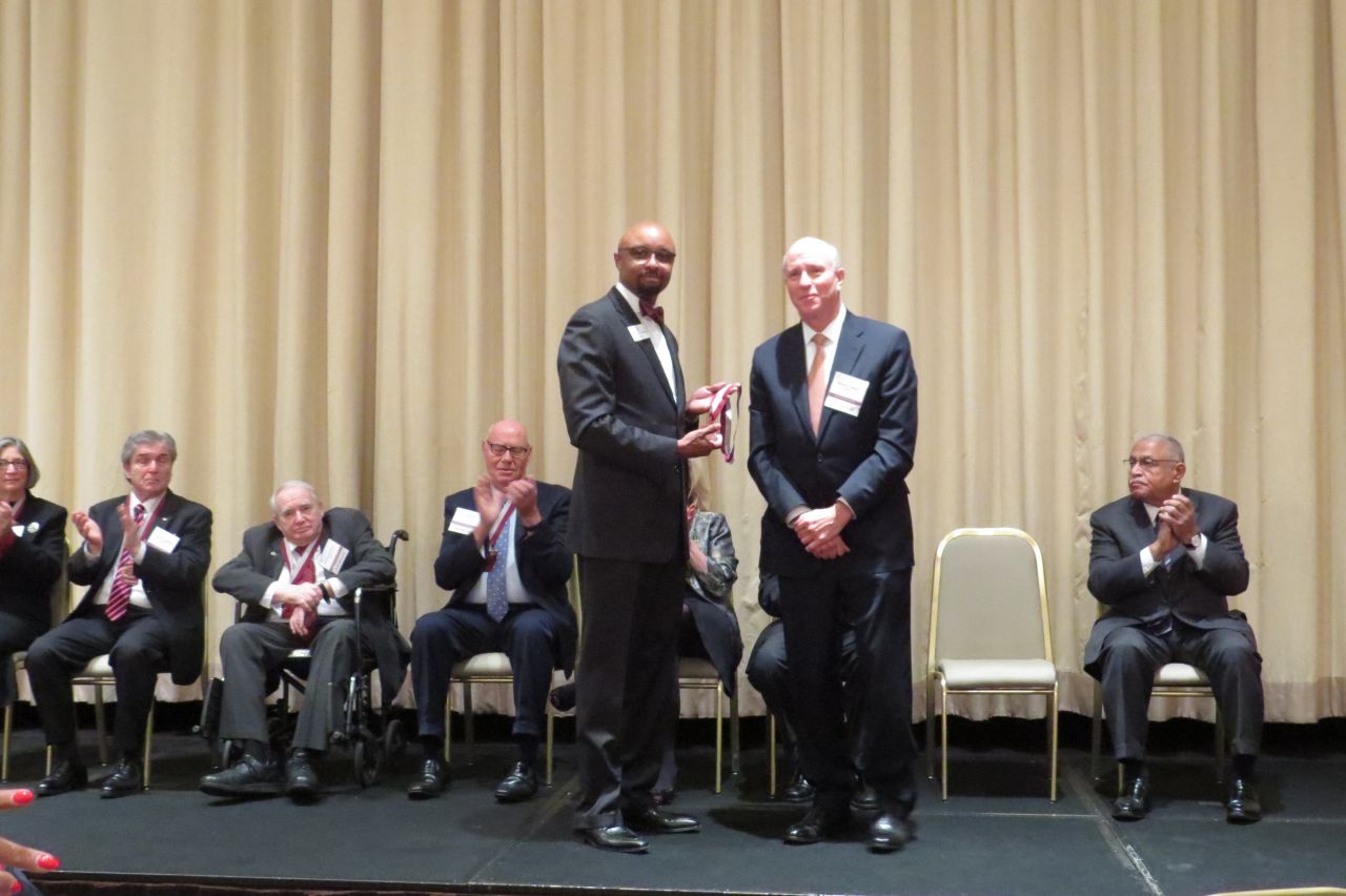 Vincent Cornelius presents Michael Reagan his award
