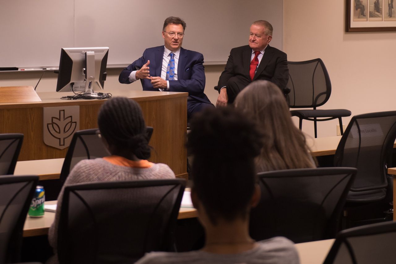 John Locallo and Judge Hartigan speak to an audience of law school students at ISBA Day at DePaul University College of Law.
