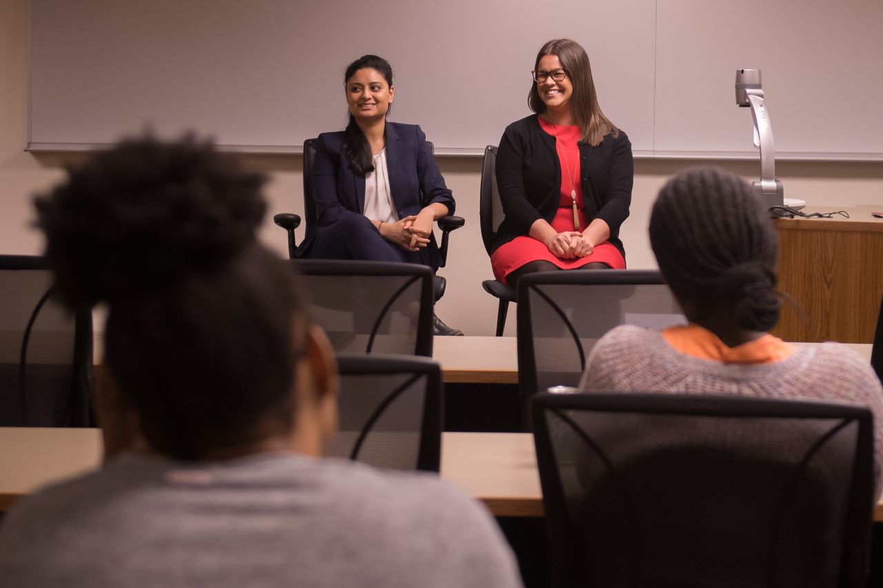 Maliha Siddiqui and Jenna DiJohn speak to an audience of law students at DePaul University College of Law.
