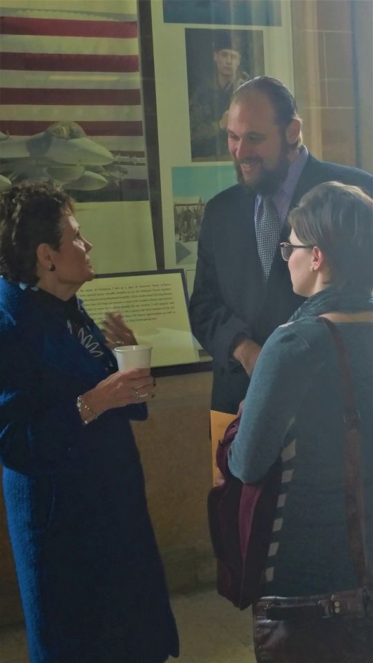 New attorney Jonathan Abrahamsen with his wife and Illinois Supreme Court Justice Rita B. Garman 