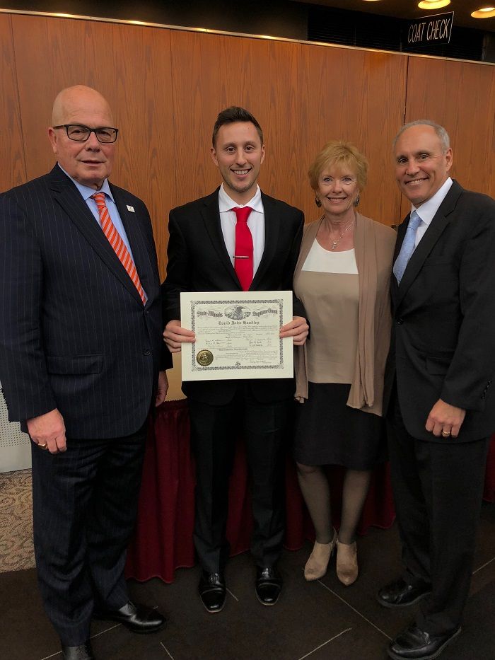 ISBA President James McCluskey with new attorney David Handley and family