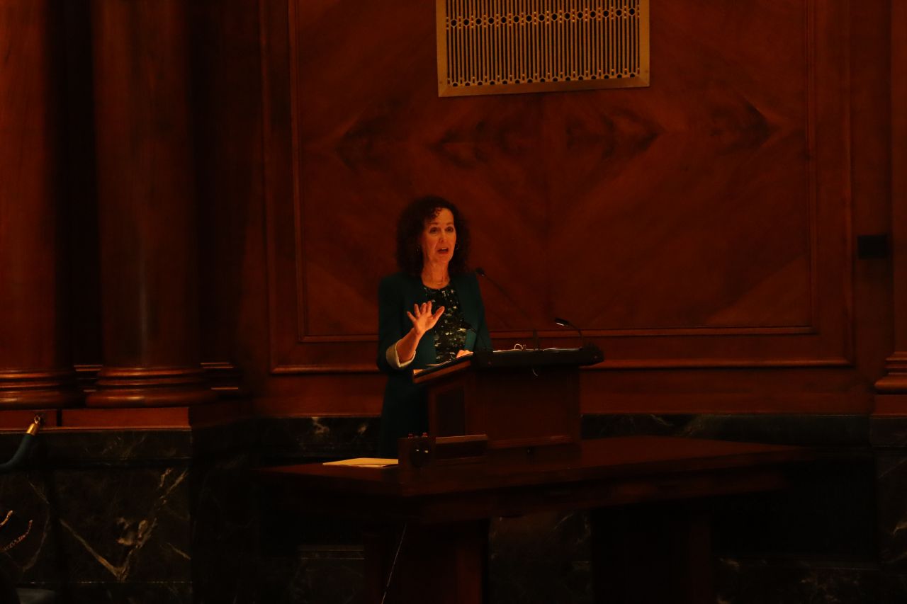 Retired Illinois Supreme Court Clerk Carolyn Taft Grosboll addresses the Fourth Judicial District candidates at the morning ceremony.