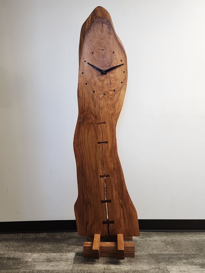 James Ahlberg: "My most prized office possession is this applewood clock I had made by an artisan in Iowa. The wood is from a macintosh apple tree of which the swings of my twin sons once hung in our backyard. It stands five feet four inches tall, so it's roughly the height of a grandmother clock."