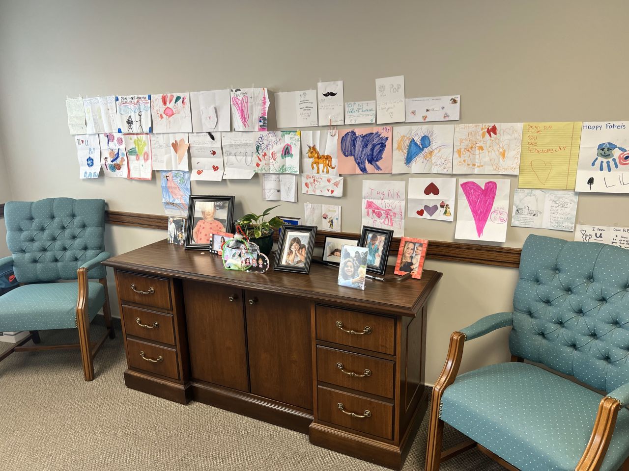 Terry Black: "I assume most peoples' prized possessions will consist of famous persons, awards, special books, or pieces or souvenirs from life or travel. I have all of those things in my office, too, but I elected to enter a picture of my "Granddaughters Wall." My granddaughters are now 11, 7, and 5 years old, but many of these pictures were drawn when they were a little younger. They all live hours away, so getting these pictures is a great pleasure to me. Self-addressed, pre-stamped envelopes I send them probably assist in this procedure."