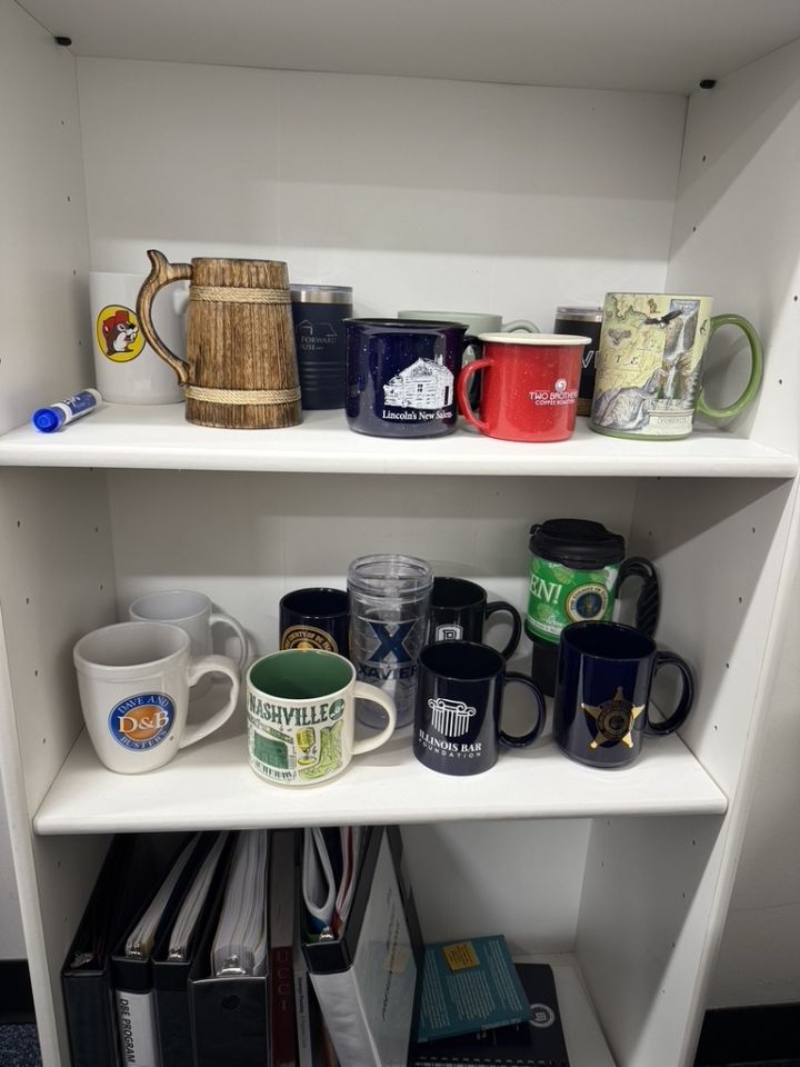 Jason Blumenthal: "I genuinely enjoy going to the office, and a big part of that is the way I've personalized the space. While I have a few photos on the wall, some knick-knacks, and other meaningful items scattered around, my most prized possession, without a doubt, is my coffee mug collection. Each mug was either gifted to me by a coworker, friend, or family member, or collected during one of my adventures. Every time I use one, I'm reminded of a happy memory or the story of how I got it."
