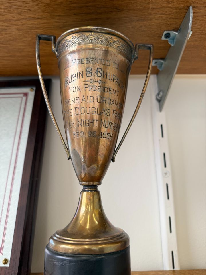 Joel Chupack: "For years I was mystified by what was 'The Men's Aid Organization of the Douglas Park Day Night Nursery' and why was my grandfather, Ruben S. Chupack, was given a trophy for 'Hon. President' in 1936. A few years earlier he emigrated from Latvia. This oddly named organization was a first of its kind. It was an orphanage and a day care center. It was formed in response to the Spanish Flu epidemic of 1918. So many parents died in this epidemic that children were on the street, literally. The nursery provided day care for the surviving parent that worked, and an orphanage for children who lost both parents. The trophy reminds me that while Ruby, as we called him, came for the American Dream. He knew that dream can only has meaning if you give of yourself to others less fortunate."