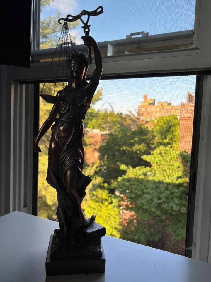 Matthew Dionne: "After clerking for a general district judge, the judge gave me a statue of Lady Justice that I have proudly placed on my desk ever since. The sword has since broken, but as a big picture perspective I find that it symbolizes that the fight for justice does not come unscathed. On a more personal level, it reminds me that my sons will find a way to play with any sword, even a blindfolded statue's. Either way, it brings me fond memories and is a reminder of what law should be about."