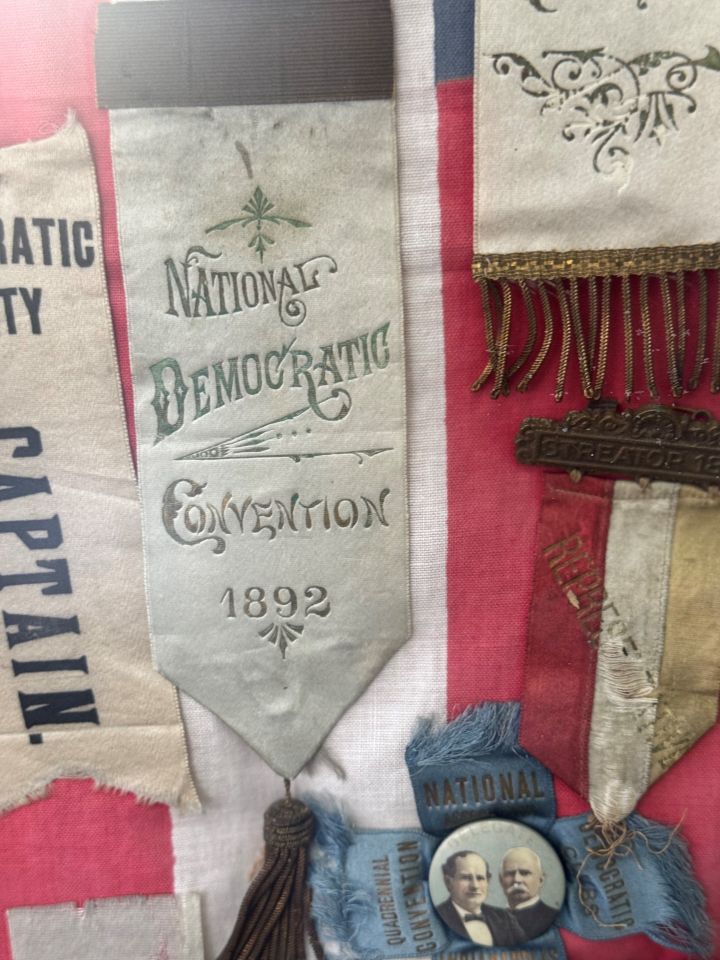 Joe Gottemoller: "Convention where William Jennings Bryan gave his 'Cross of Gold' speech. It made him famous and made him the model for the Wizard in the Wizard of Oz. Later in life, Mr. Bryan and Mr. Clarence Darrow litigated the Scopes Monkey Trial. We know it as 'Inherit the Wind.' The ribbon reminds me that no matter what side I am on, there were great lawyers that came before us who won and lost hard-fought cases. Every day I am in this profession I have the chance to do the same. PS The Blue ribbon in the bottom includes a picture of Mr. Bryan four years later in 1900."