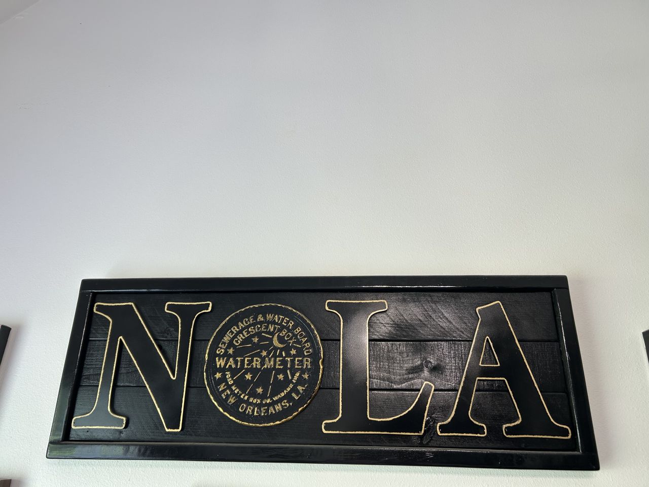 Kirsten Stevens: "My beautiful piece of art adorns the wall just above left of my computer monitor. I’m fortunate to be a snowbird after 32 years of practice and get to glance at this gem throughout the day in my Mandeville, LA home near Lake Pontchartrain. While serving clients and attending Zoom court, I look up to plan my next adventure in the 307-year-old city I love!"