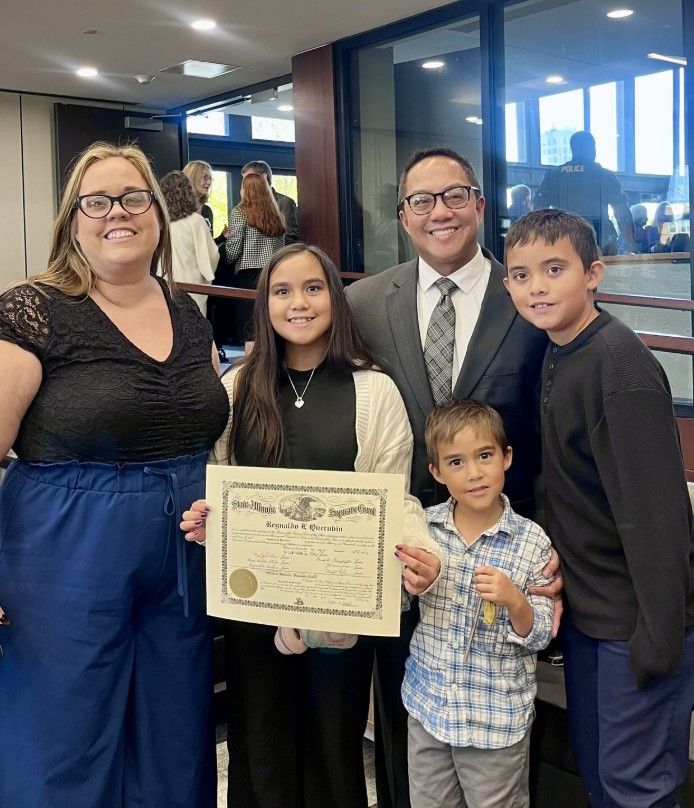 New lawyer Reynaldo celebrates with his family
