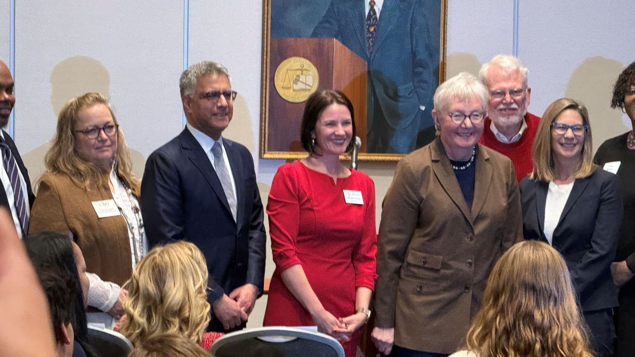 Justice Sanjay Tailor (2nd from left), ISBA President Bridget Duignan (center), and Justice Mary Jane Theis