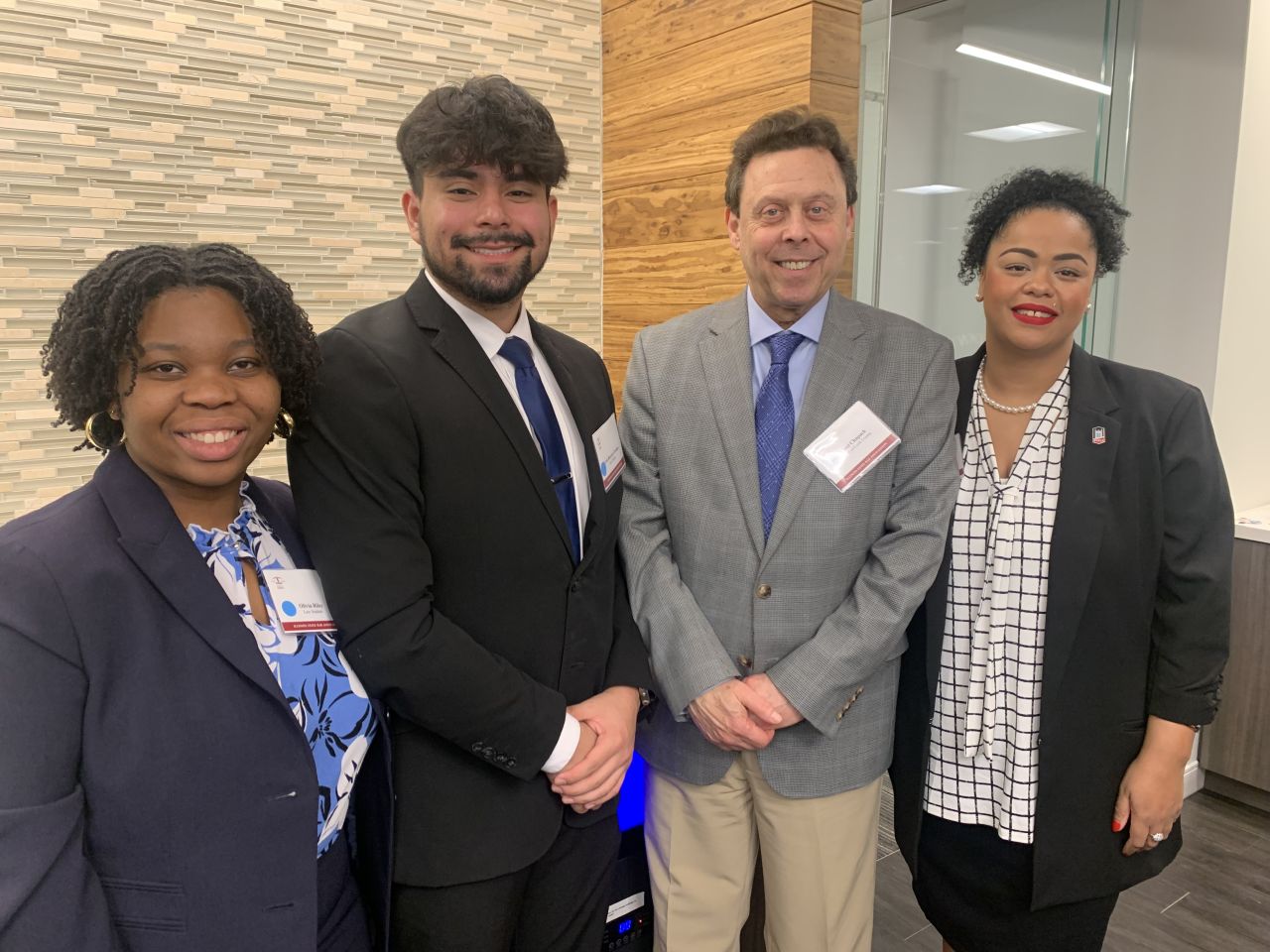 NIU Law Students network with Judge Joel Chupack at the Wine Tasting Event.