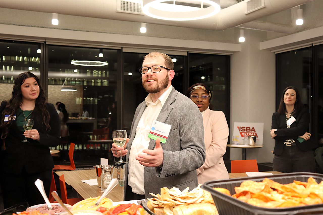 YLD Chair Jason Blumenthal welcomes attendees to the Wine Tasting event.