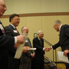 Former Gov. Jim Thompson receives his certificate as a member of the 1959 Class of Senior Counsellors.