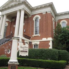 The building sits at 1004 Columbus, across from Washington Park.