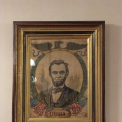 An image of Abraham Lincoln sits on the wall opposite ...