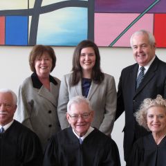 Front row: Justices Freeman, Fitzgerald and Burke. Back row: ISBA member Al Durkin (right) with his wife, Kathy, and daughter Jessica, who was admitted to the bar on Thursday.