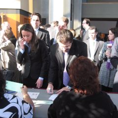 New admittees sign in before the ceremony.