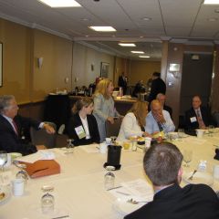 Laurel Bellows (standing center) addresses the Illinois delegation