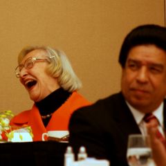 Dawn Clark Netsch enjoys a laugh as Cook County Judge Jesse Reyes looks on.