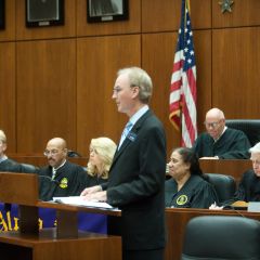 District XI Justice John K. Norris addresses the initiates during the ceremony.