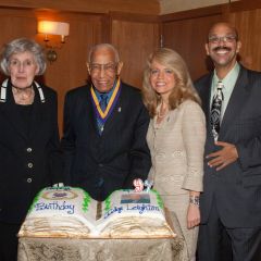 Justice Mary Ann G. McMorrow, Michele Jochner and Pierre Priestley congratulate Judge Leighton on his 97th birthday.