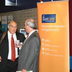 Mark Hassakis, ISBA's President Elect, converses with attendees in the Exhibitor's hall.