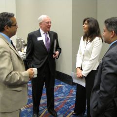 President O'Brien speaks with CBA President Alvarez as Leo Lastre and Puerto Rican Bar Association President Enrique Abraham look on.