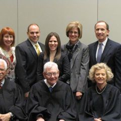 New admittee Michele Rajfer (rear, center) and family with the justices.
