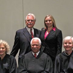 New admittee Jessica Kull with her father, Judge Geary Kull, with the justices.