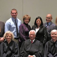 New admittee Lauren Davalle with her family and the justices.
