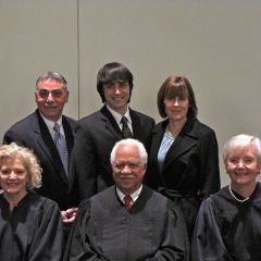 New admittee Michael Pellegrino with his father, ISBA member Richard Pellegrino, his mother and the justices.