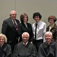 New admittee Colette Willer with her family and the justices.