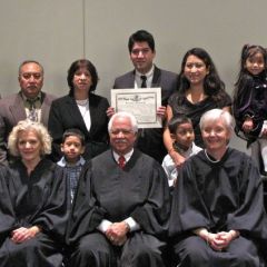 New admittee Leonardo Morales with his family and the justices.