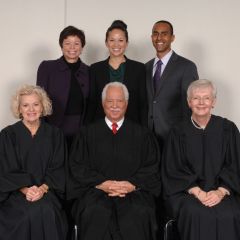 White House senior advisor Valerie Jarrett with her daughter, new admittee Laura Jarrett and friend Anthony Balkissoon pose with Justices Anne Burke, Charles Freeman and Mary Jane Theis.