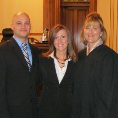 New admittee Jon Giraudo, his wife, new admittee Kelly Giraudo and Justice Mary K. O'Brien