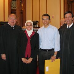 Justice Robert L. Carter, new admittee Mona Elgindy, her husband, Waleed Gabr and Justice Tom M. Lytton.