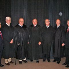 Justices and speakers for the Fifth District ceremony in Collinsville. ISBA Secretary Carl Draper is at the far right.
