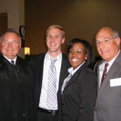 New admittees Tameeka L. Purchase and Gary S. Peeples (center) visit with Justice Lloyd A. Karmeier (left) and ISBA President Mark D. Hassakis after being sworn in at the 5th District Ceremony